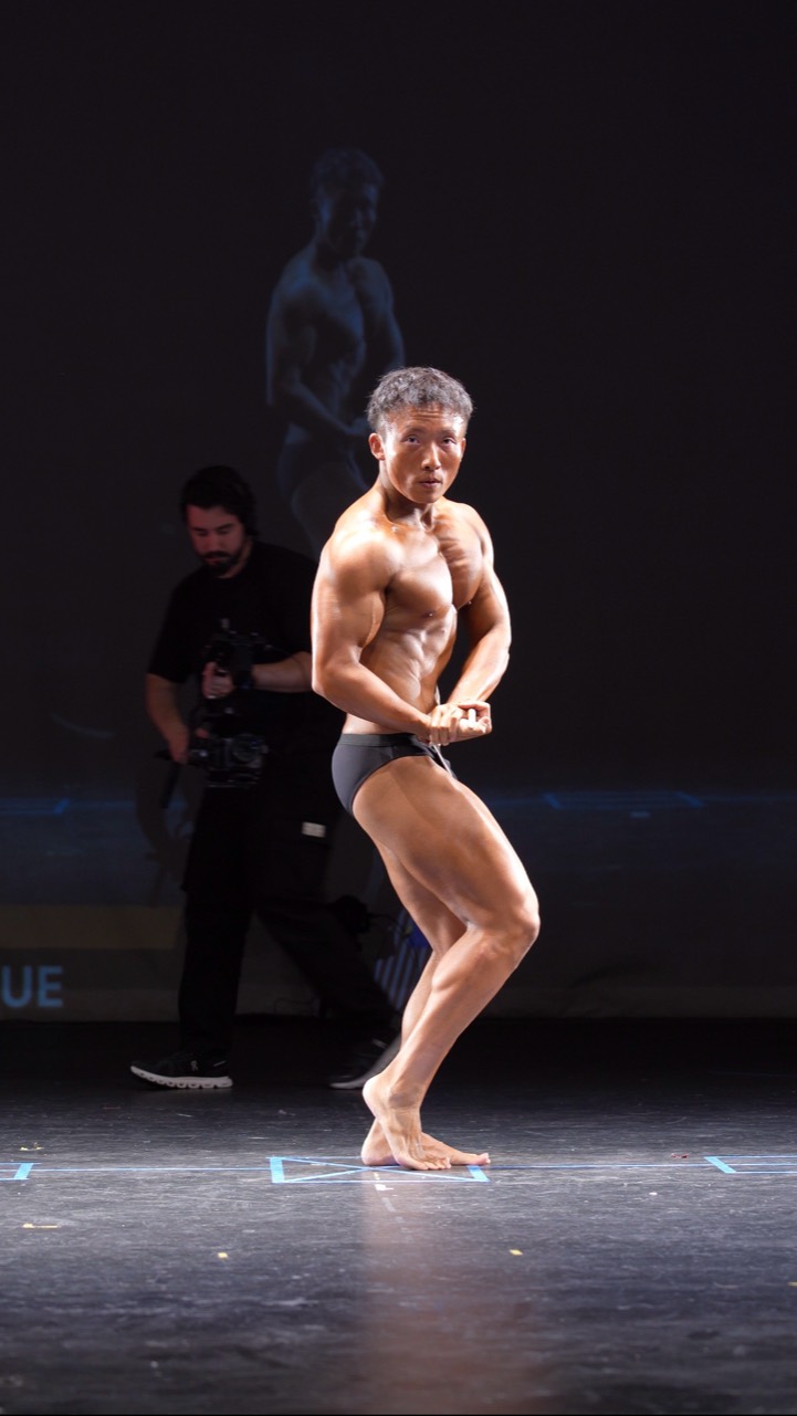 ZT Li posing on stage after his transformation